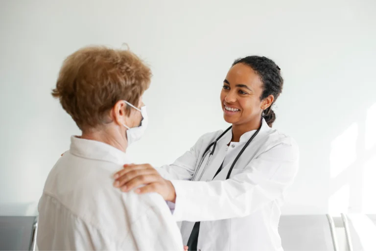 side-view-smiley-doctor-talking-patient 1